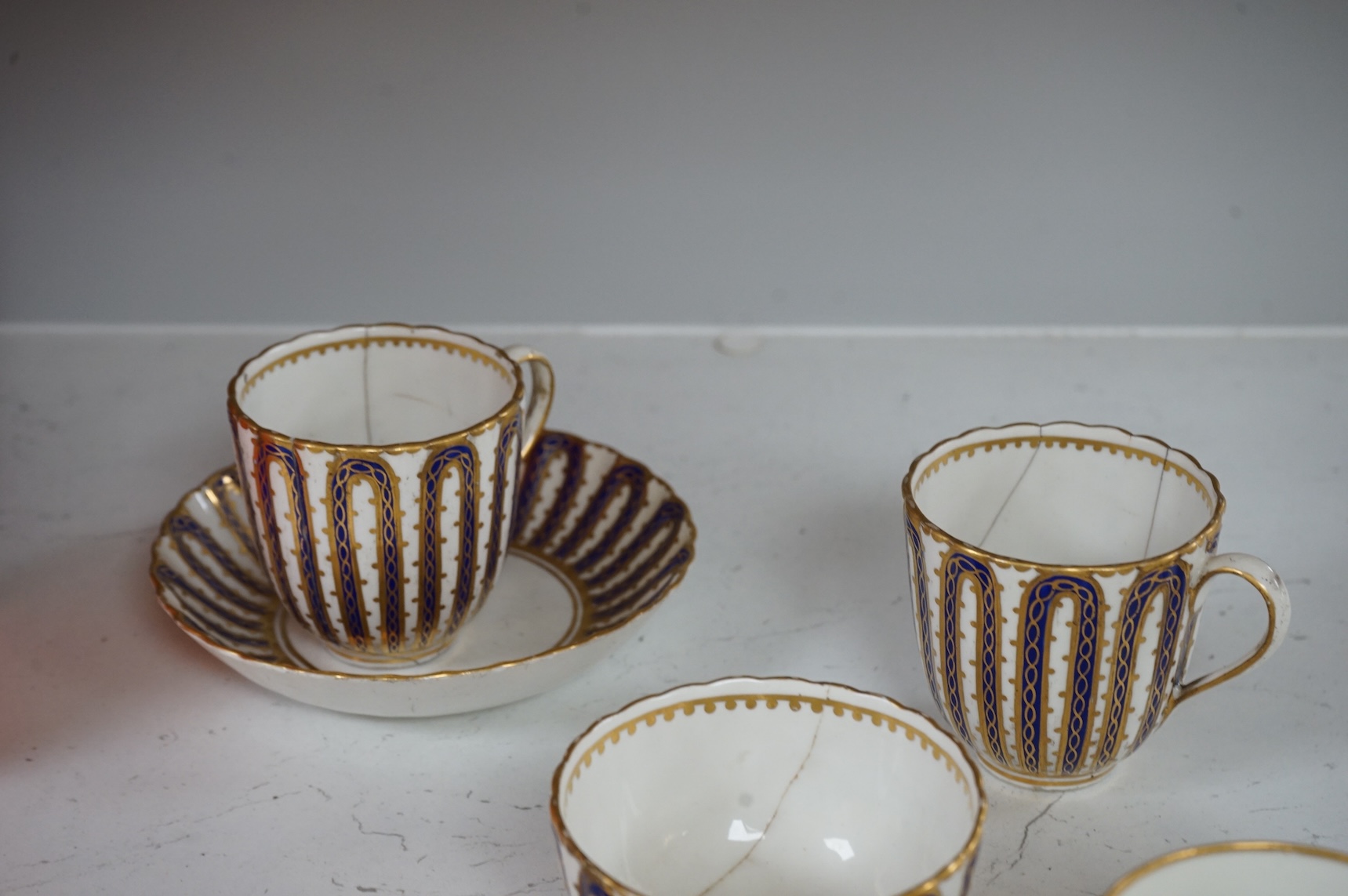 Two late 18th century Derby cornflower pattern coffee cups and saucers and Derby tea and coffee wares, largest 13cm in diameter